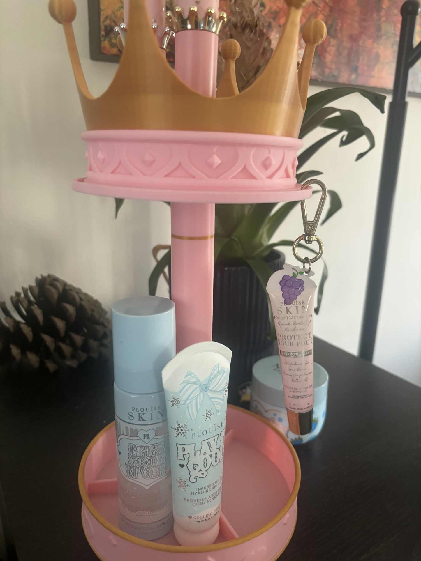 PLouise carousel makeup display with extra storage in base